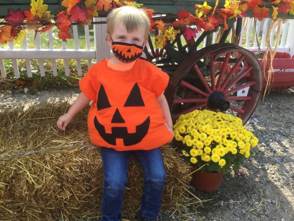 Child dressed in a pumpkin costume